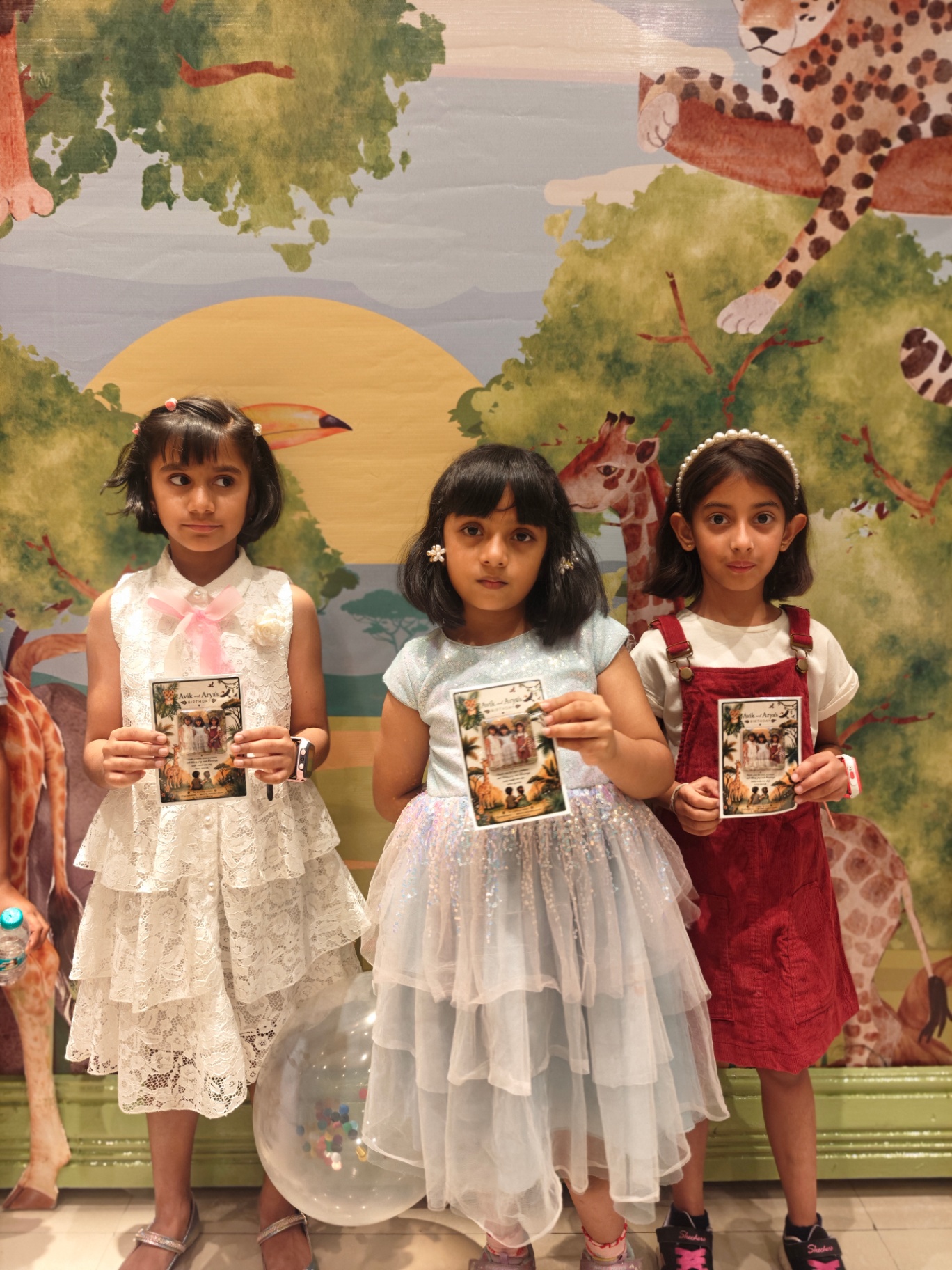 Happy kids holding their personalised event magnets