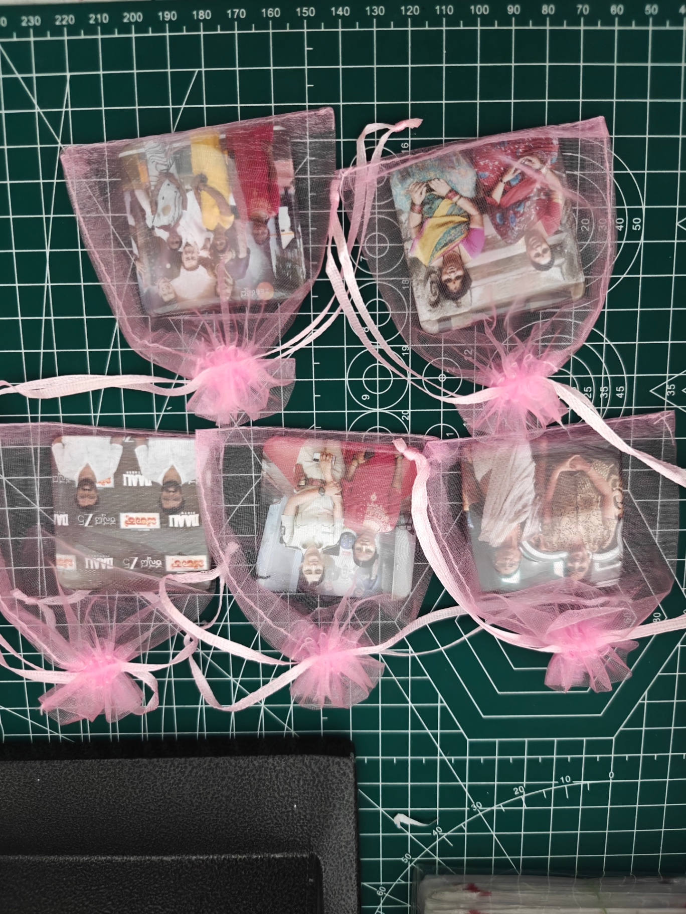 Photo magnets gift-wrapped in organza pouches